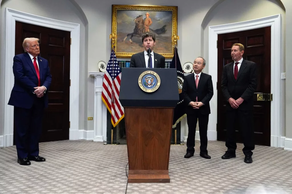 altman speaking in the white house’s roosevelt room with trump, son and ellison