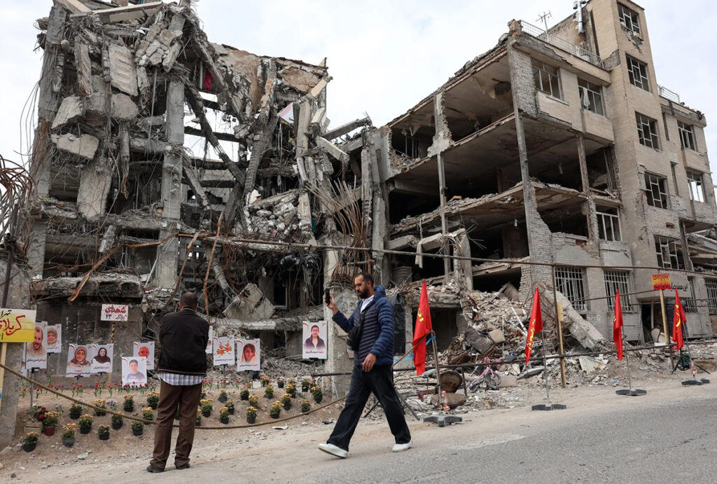 iranians after an airstrike on a residential building in tehran on april 13 iran war 1200x810