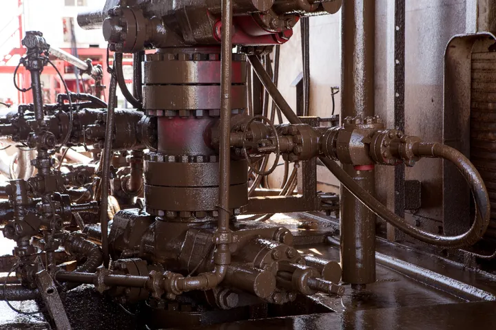 oil pipes at a drilling rig in añelo, argentina
