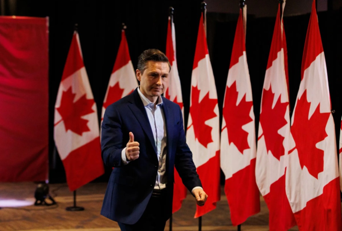 pierre poilievre in front of canada flags 1200x810