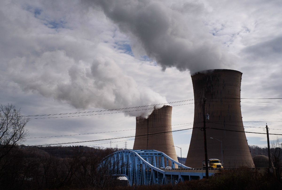 The FirstEnergy Corp. Beaver Valley nuclear power station stands next to the Shippingport Bridge in Shippingport, Pennsylvania, U.S., on Wednesday, Dec. 6, 2017. Across America, few places are as dominated by big, centralized power plants as Shippingport. It was here, in the 1950s, that the federal government teamed up with private industry to build the country's first nuclear power plant. Photographer: Justin Merriman/Bloomberg