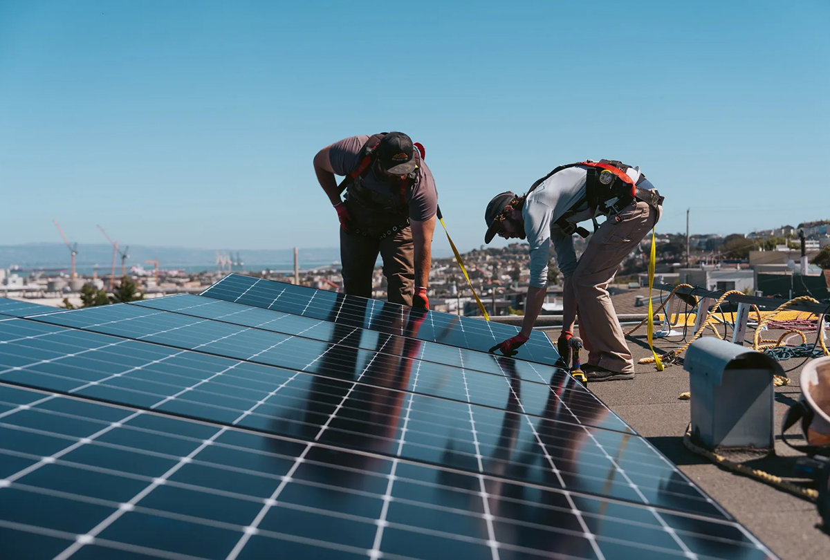 workers install solar panels on a home in san francisco 1200x810